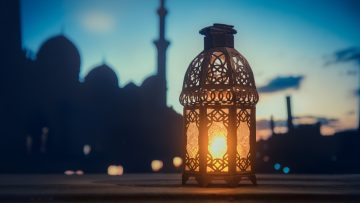 Ramadan Kareem greeting photo with serene mosque background with